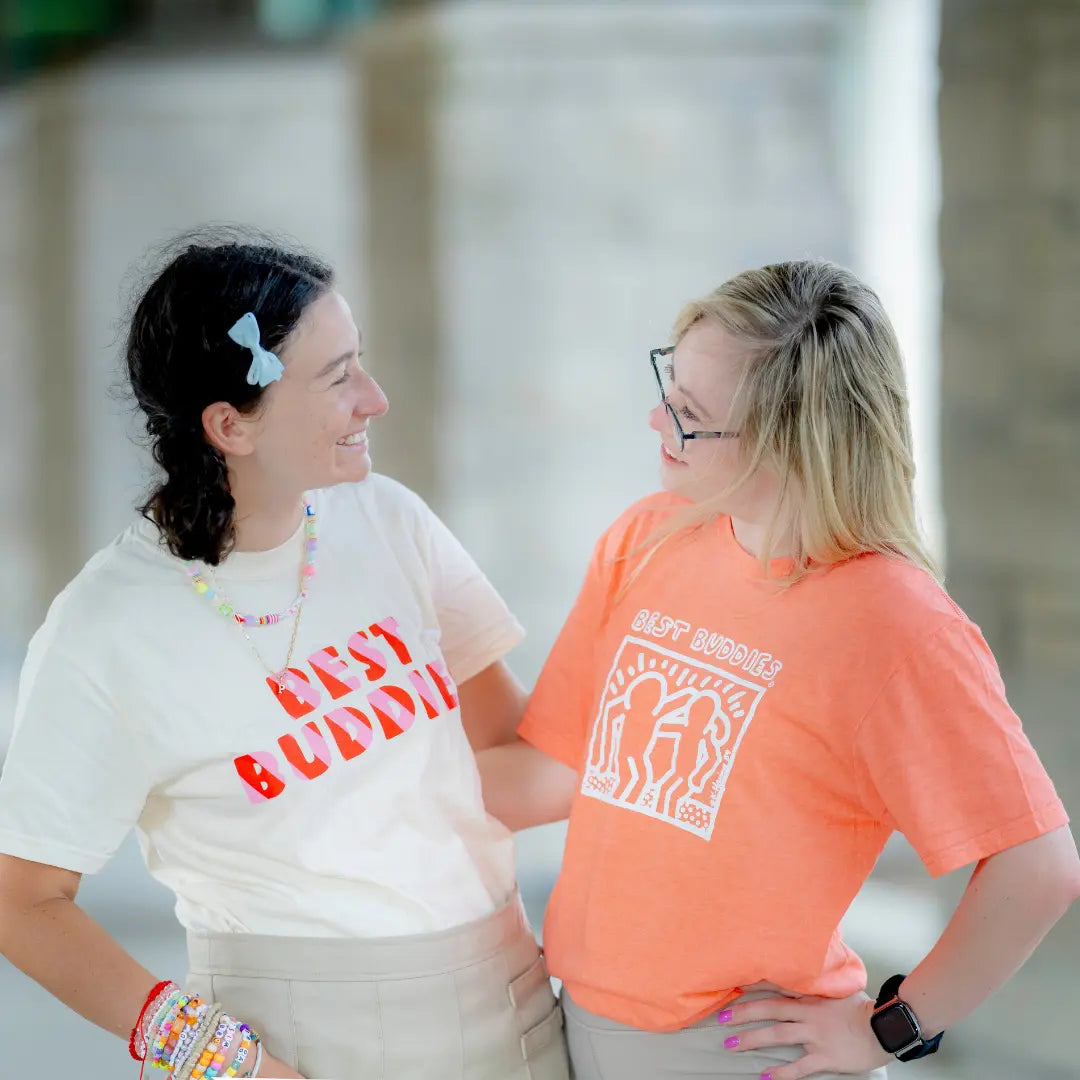 Orange tee shirt with White Haring Best Buddies Logo on the front