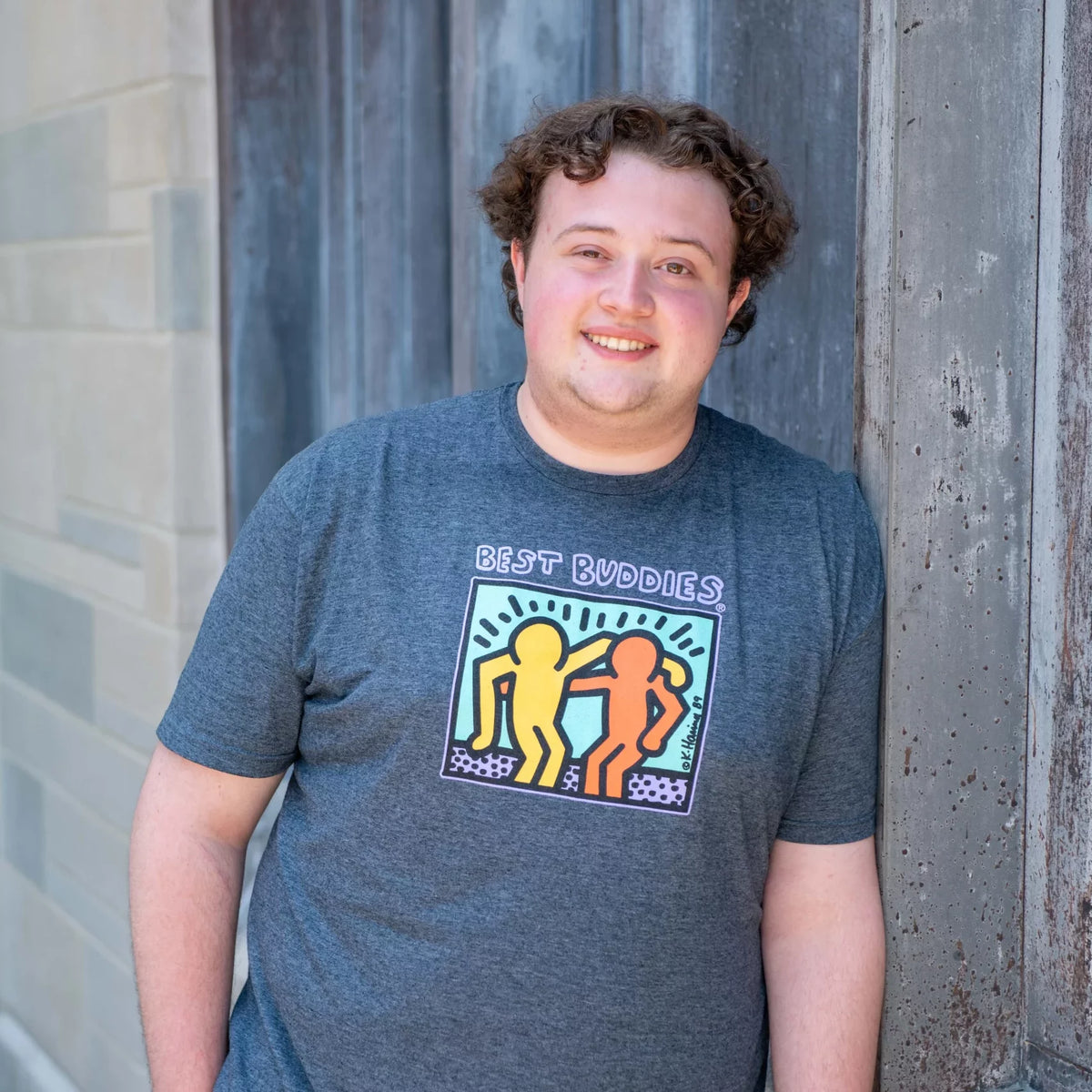 Gray tee shirt with colorful traditional haring Best Buddies logo on the front