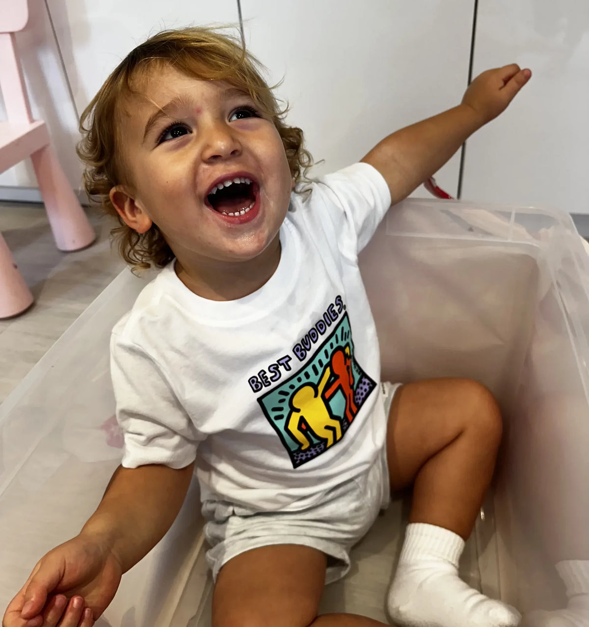 White toddler tee shirt with colorful traditional Haring Best Buddies Logo on the front