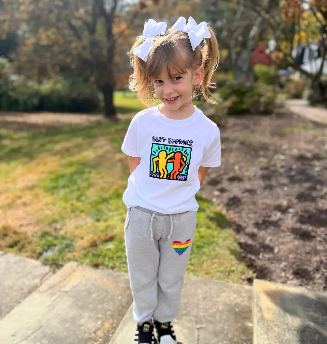 White toddler tee shirt with colorful traditional Haring Best Buddies Logo on the front
