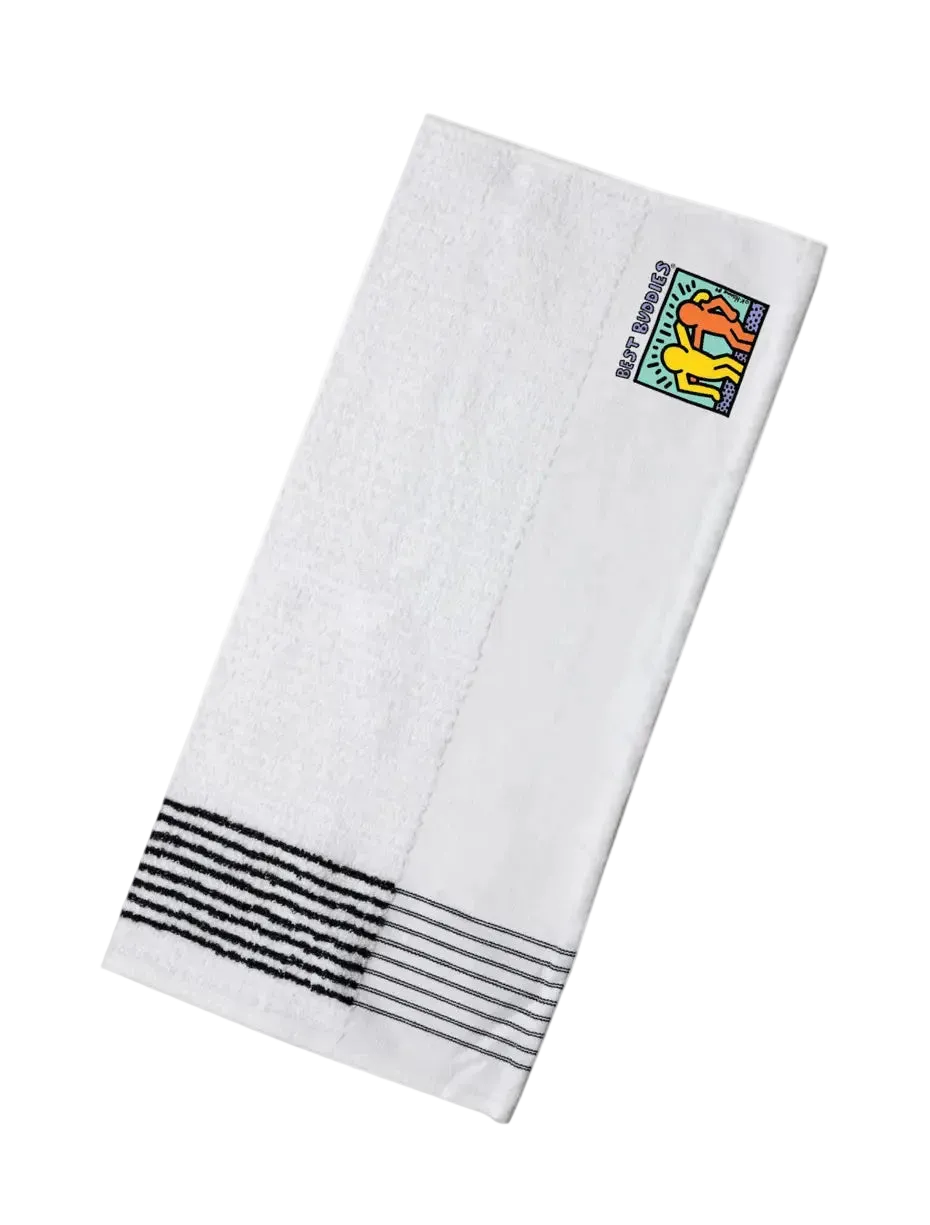 Best Buddies golf caddy towel. White with black stripes on the end and the Haring logo on the other side.
